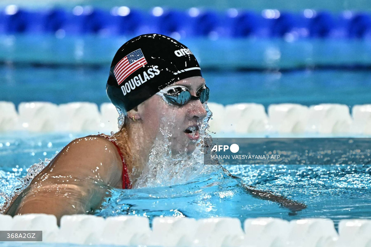 US' Kate Douglass competes in the semifinal of the women's 200m breaststroke swimming event during the Paris 2024 Olympic Games at the Paris La Defense Arena in Nanterre, west of Paris, on July 31, 2024. - AFP