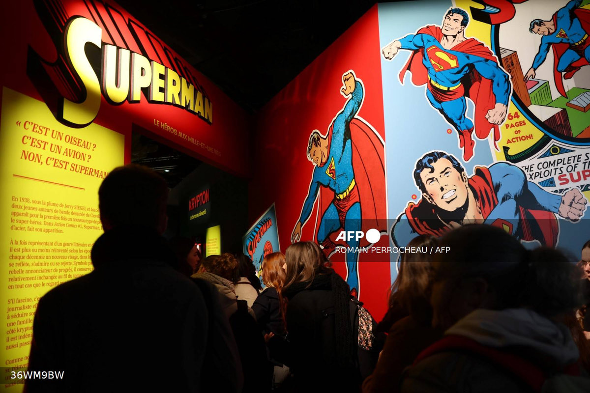 People visit the exhibition titled “Superman, the hero with a thousand and one lives” during the 52nd Angouleme International Comics Festival in Angouleme, on January 30, 2025. - AFP