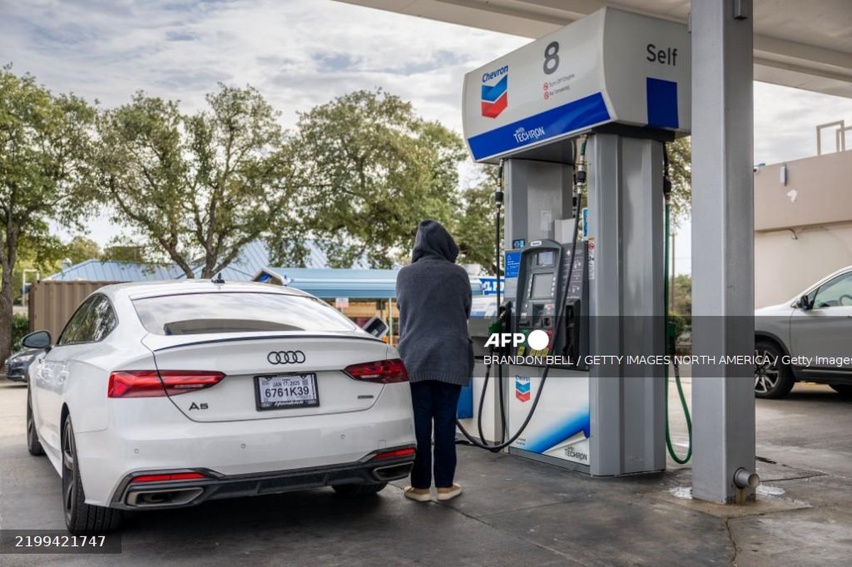 A customer pumps gas at a Chevron gas station on February 13, 2025 in Austin, Texas. - Getty Images via AFP