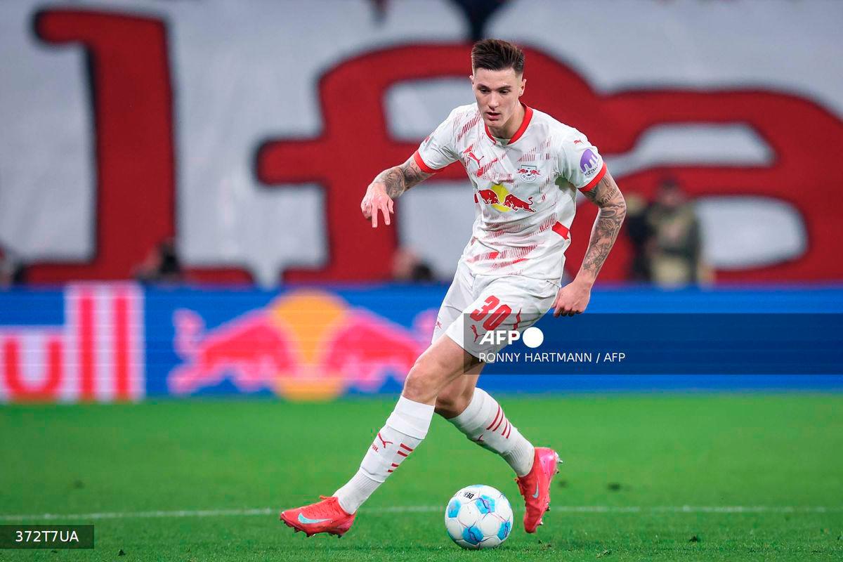 Leipzig's Slovenian forward #30 Benjamin Sesko plays the ball during the German first division Bundesliga football match between RB Leipzig and Borussia Dortmund in Leipzig, eastern Germany on March 15, 2025. - AFP
