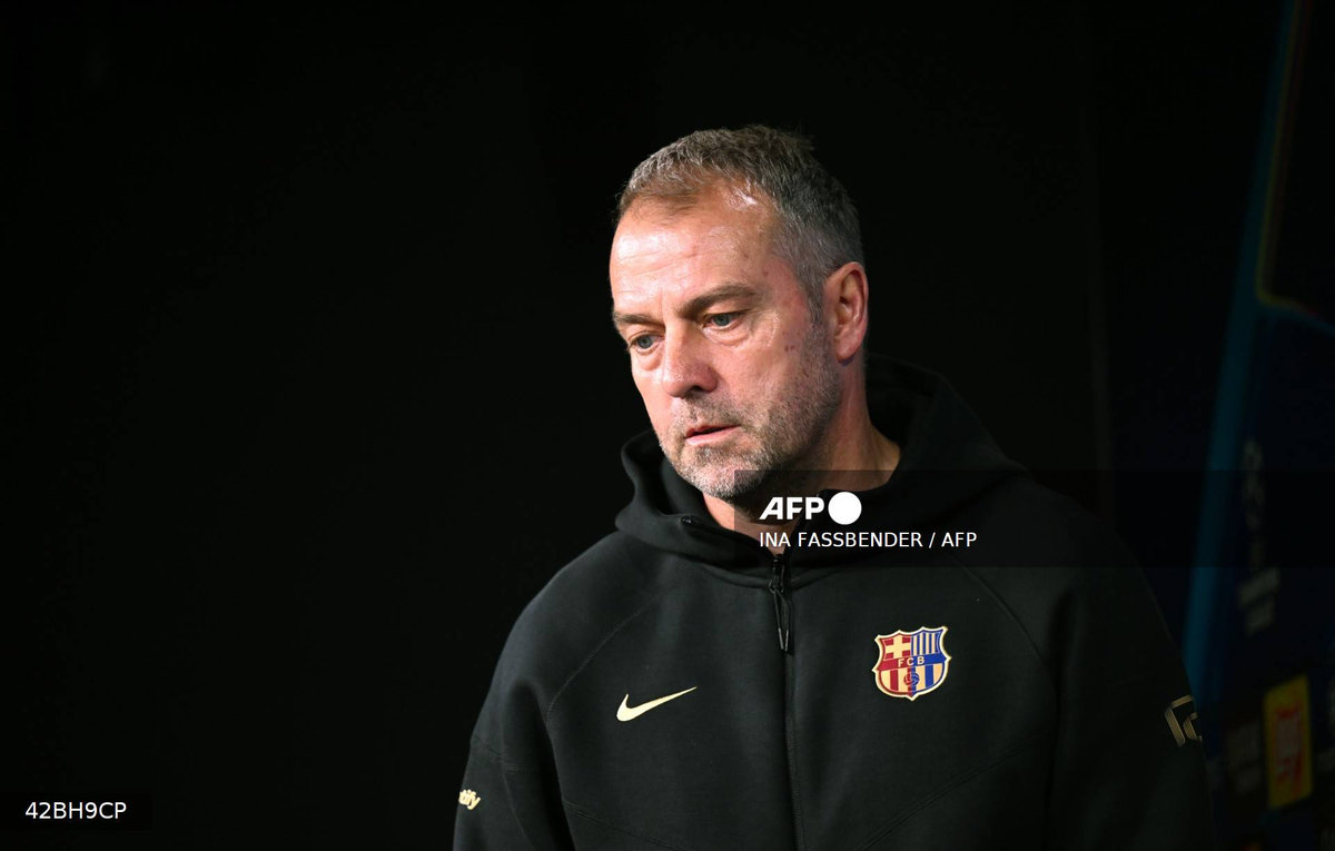 Barcelona's German head coach Hansi Flick arrives for a press conference on the eve of the UEFA Champions League quarter-final second-leg football match BVB Borussia Dortmund v FC Barcelona at the Signal Iduna stadium in Dortmund on April 14, 2025. - AFP