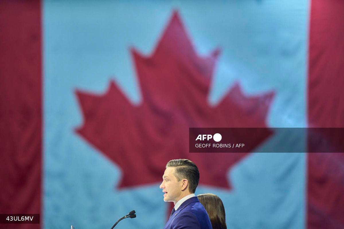 Canada's Conservative leader Pierre Poilievre speaks alongside his wife Anaida at the Conservative election party at the Rogers Centre in Ottawa, Ontario on April 28, 2025. - AFP