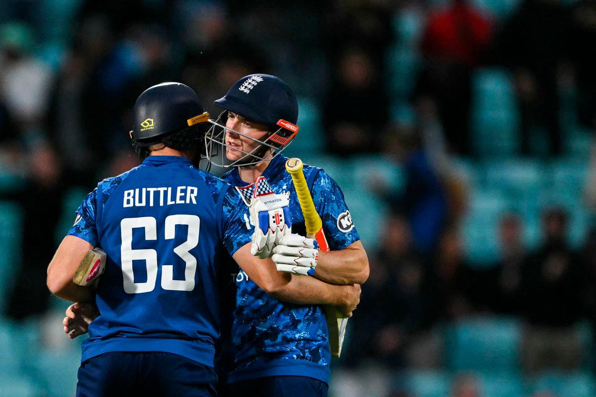 England’s Jos Buttler (L) hugs England’s Harry Brook (R) as they celebrate after winning the third One Day International (ODI) cricket match between England and West Indies at The Oval, in London, on June 3, 2025. England beat West Indies by seven wickets in 3rd ODI to seal 3-0 series sweep. (Photo by Glyn KIRK / AFP)