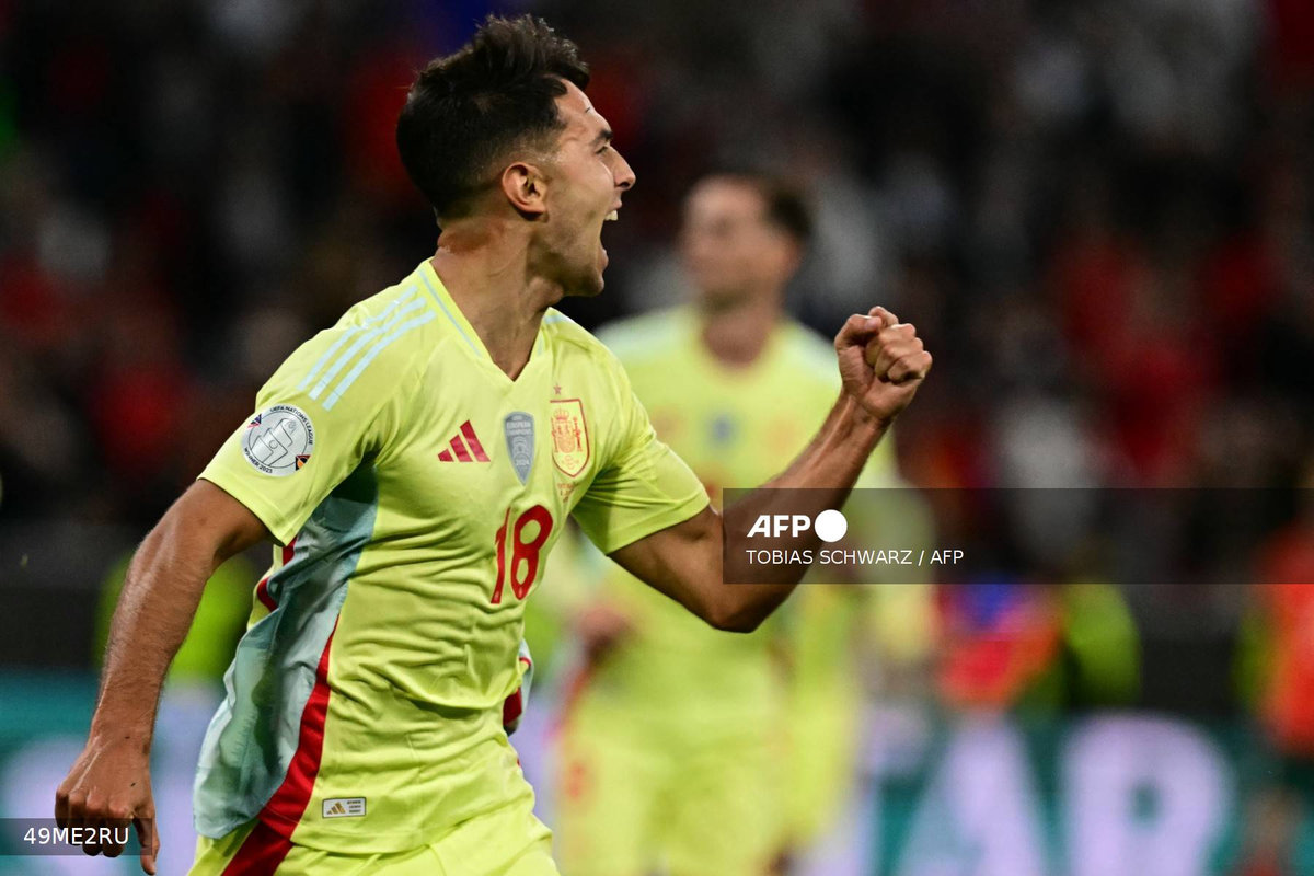 Spain’s midfielder #18 Martin Zubimendi celebrates scoring the opening goal with his teammates during the UEFA Nations League final football match between Portugal and Spain in Munich, southern Germany on June 8, 2025. - AFP