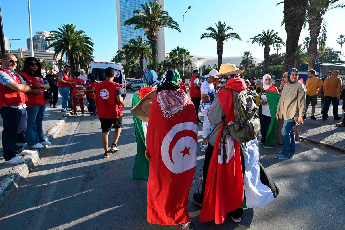 Tunisians gather at a meeting point in Tunis on June 9, 2025, ahead of the departure of a land convoy named “Steadfastness” to break the siege on Gaza. (Photo by FETHI BELAID / AFP)