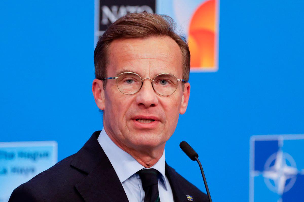 Sweden’s Prime Minister Ulf Kristersson speaks to the media upon arriving to attend the North Atlantic Treaty Organization (NATO) Heads of State and Government summit in The Hague, on June 25, 2025. (Photo by Ludovic MARIN / POOL / AFP)