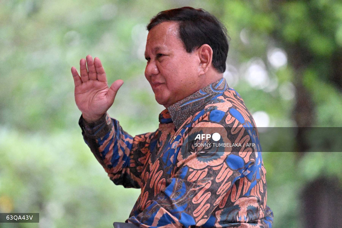 Indonesia’s President Prabowo Subianto waves to people after the inauguration of Sanur Special Economic Zone and Bali International Hospital in Denpasar, on Indonesia’s resort island of Bali on June 25, 2025. - AFP