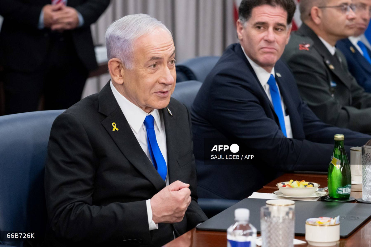 Israeli Prime Minister Benjamin Netanyahu (L) speaks during a meeting with US Secretary of Defense Pete Hegseth at the Pentagon in Washington, DC, on July 9, 2025. - AFP