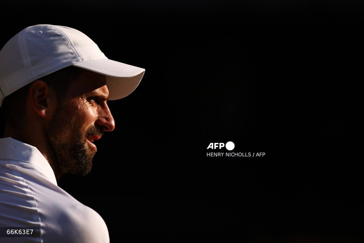 Serbia's Novak Djokovic looks on as he plays against Italy's Jannik Sinner during their men's singles semi-final tennis match on the twelfth day of the 2025 Wimbledon Championships at The All England Lawn Tennis and Croquet Club in Wimbledon, southwest London, on July 11, 2025. - AFP