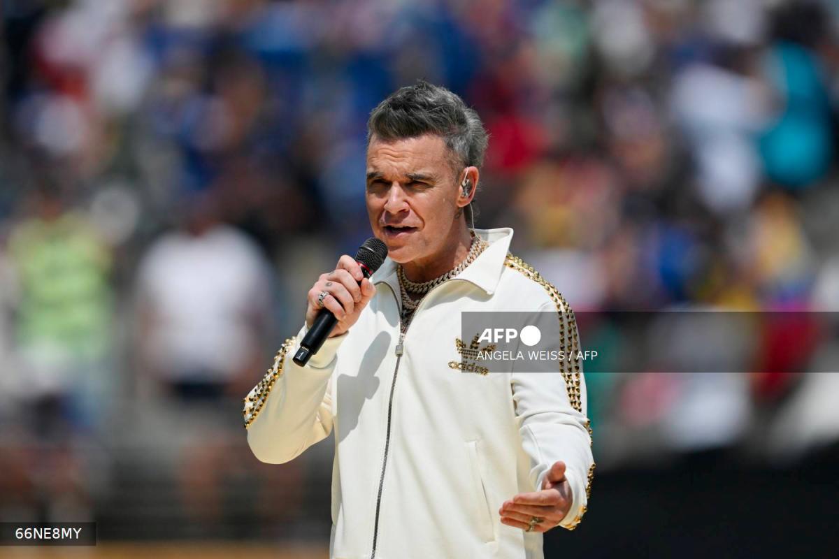 English singer-songwriter Robbie Williams performs before the FIFA Club World Cup 2025 final football match between England's Chelsea and France's Paris Saint-Germain at the MetLife Stadium in East Rutherford, New Jersey on July 13, 2025. - AFPPIX