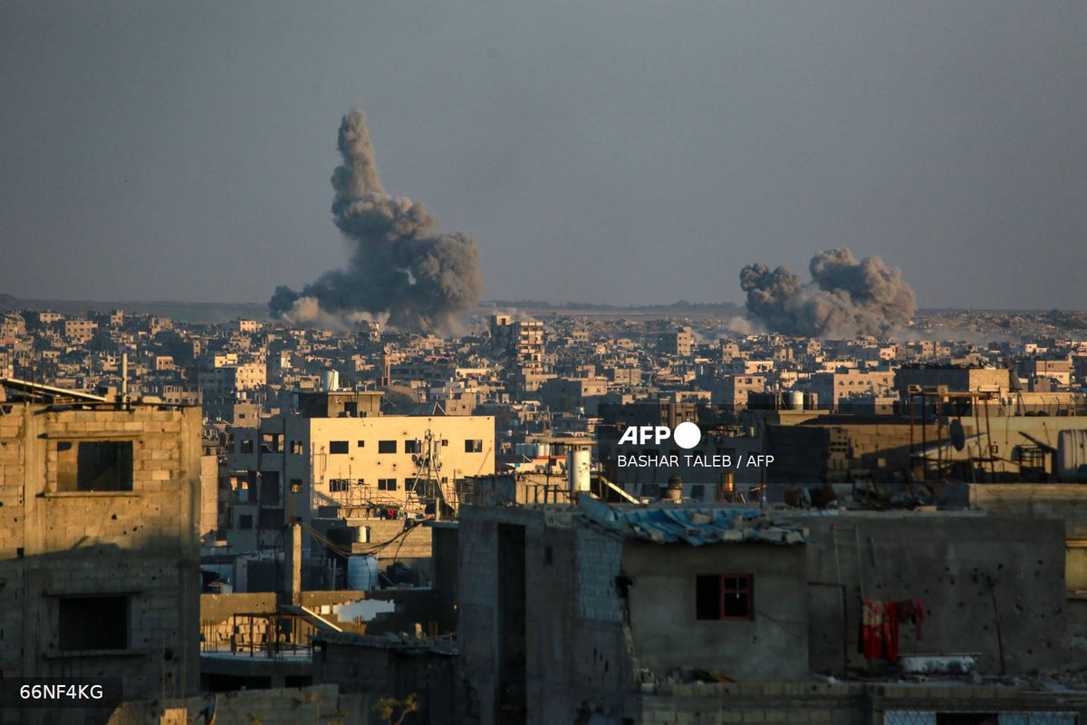 This picture taken from western Jabalia in the central Gaza Strip shows smoke billowing east of Gaza City, in the central Gaza Strip following Israeli strikes on July 13, 2025. Delegations from Israel and the Palestinian militant Hamas group have now spent a week trying to agree on a temporary truce to halt 21 months of devastating fighting in the Gaza Strip. - AFP