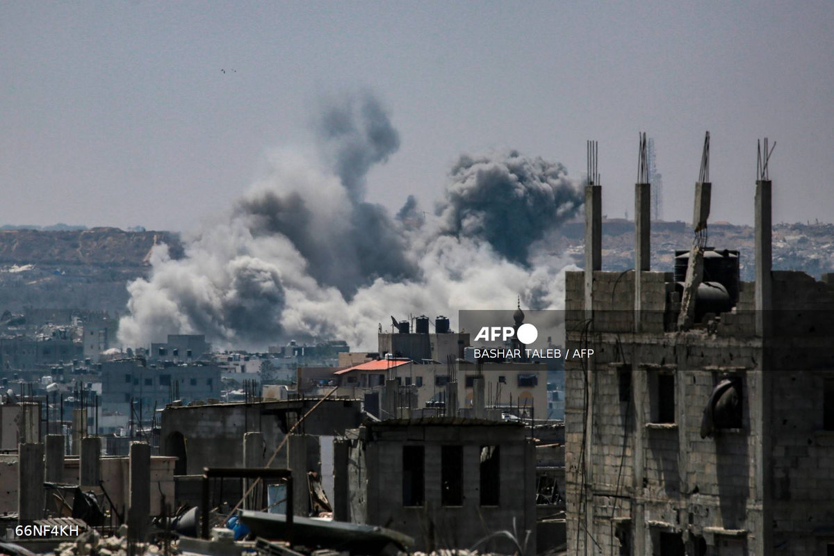 This picture taken from western Jabalia in the central Gaza Strip shows smoke billowing east of Gaza City, in the central Gaza Strip following Israeli strikes on July 13, 2025. - AFP