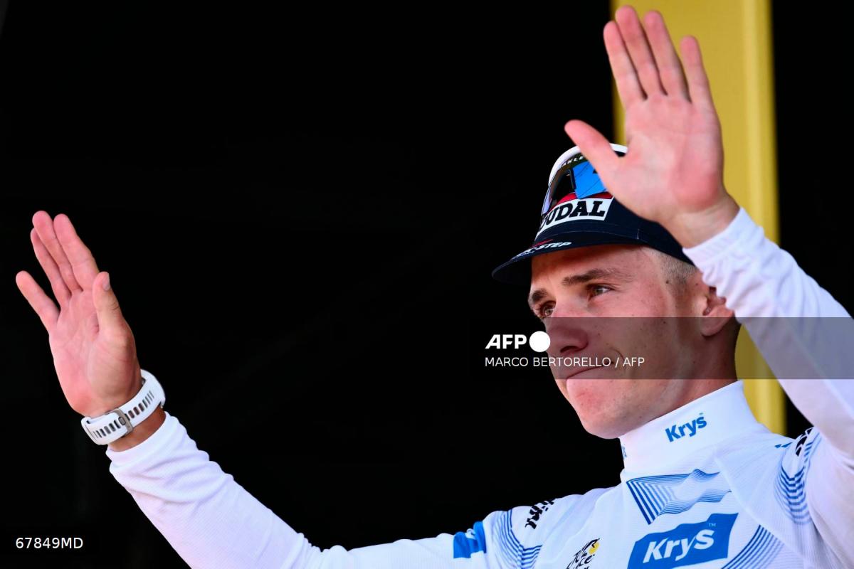 Soudal Quick-Step team's Belgian rider Remco Evenepoel celebrates on the podium with the best young rider's white jersey after the 13th stage of the 112th edition of the Tour de France cycling race, 10.9 km individual time trial between Loudenvielle and Peyragudes, in the Pyrenees mountains of southwestern France, on July 18, 2025. - AFPPIX