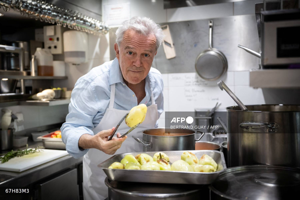 French chef Alain Passard poses in his restaurant 'L'Arpege' in Paris during a photo session on July 22, 2025. - AFP
