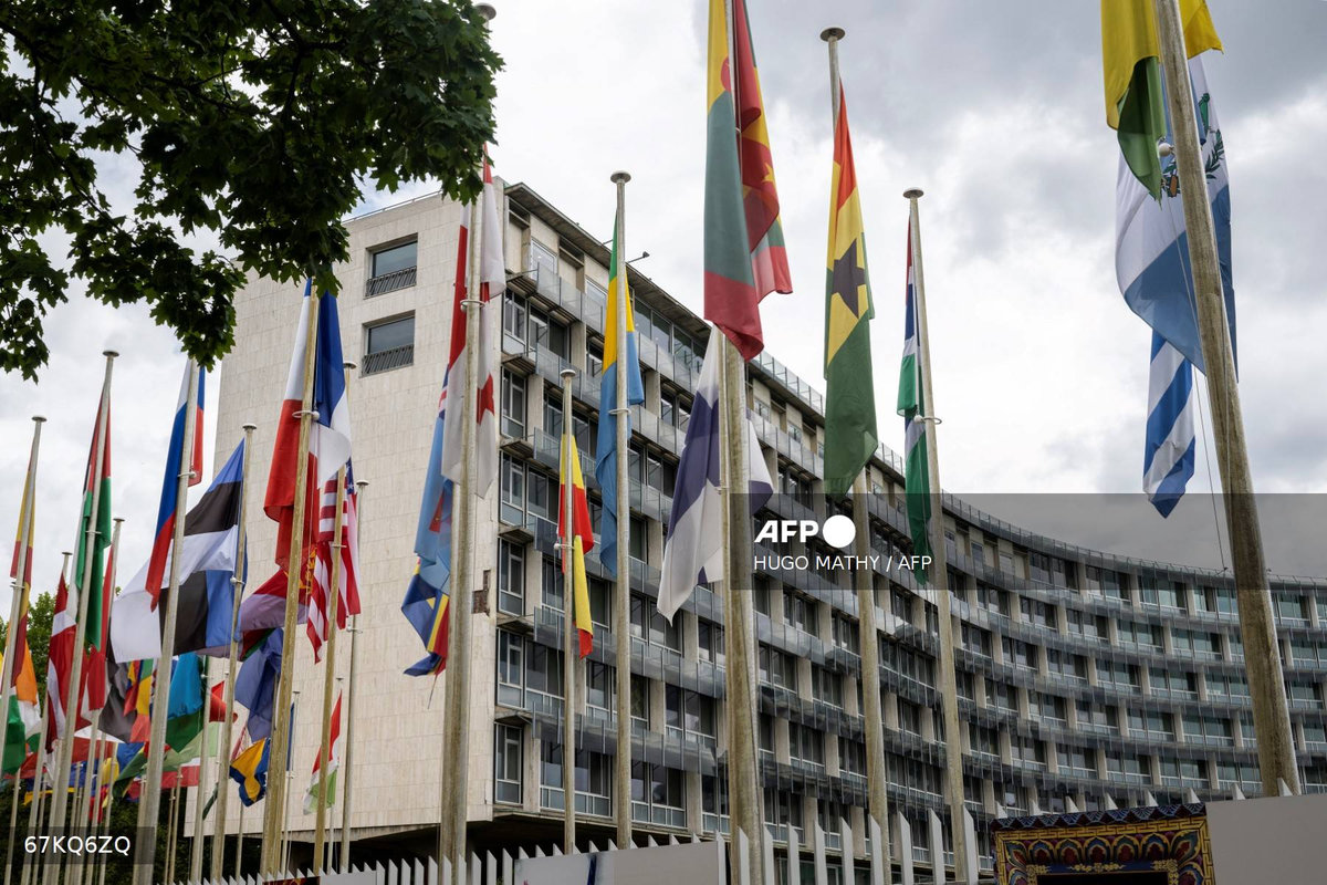 This photograph taken on July 23, 2025 shows flags flying in front of the United Nations Educational, Scientific and Cultural Organisation (UNESCO) headquarters in Paris. - AFP