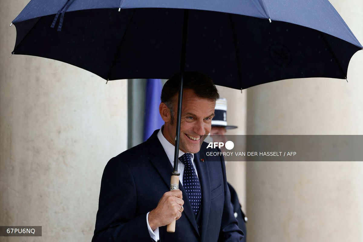 France's President Emmanuel Macron waits for Lebanon's Prime Minister ahead of their working lunch at the presidential Elysee Palace in Paris, on July 24, 2025. - AFP