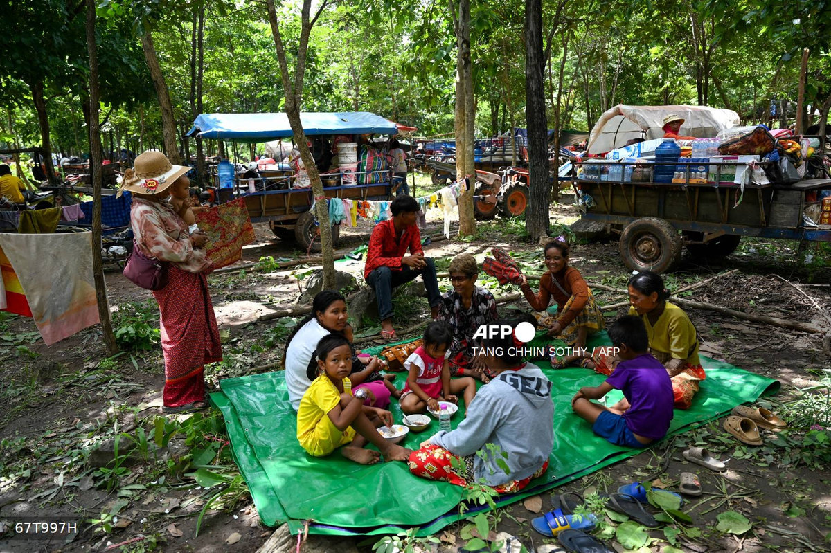 People who fled their homes near the Cambodia-Thailand border rest on the grounds of a pagoda in Oddar Meanchey province on July 25, 2025. - AFP