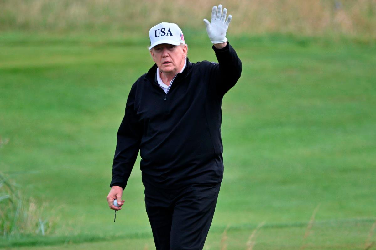 US President Donald Trump reacts as he plays golf at the Trump Turnberry Golf Courses, in Turnberry on the south west coast of Scotland on July 26, 2025, during the second day of his visit to the country, since his second tenure as President began. - AFP