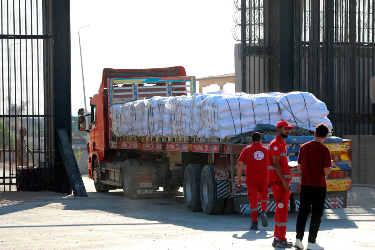 A truck loaded with humanitarian aid drives toward the Gaza Strip through the Egyptian side of the Rafah crossing on July 27, 2025. (Photo by AFP)
