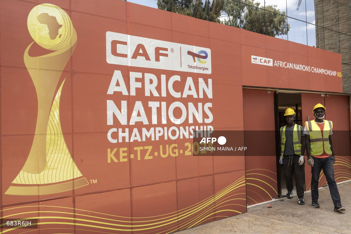 Construction workers exit the main gate at the Nyayo national stadium VIP entrance, in Nairobi on July 28, 2025, ahead of the CAF African Nations Championship (CHAN) 2024. - AFP
