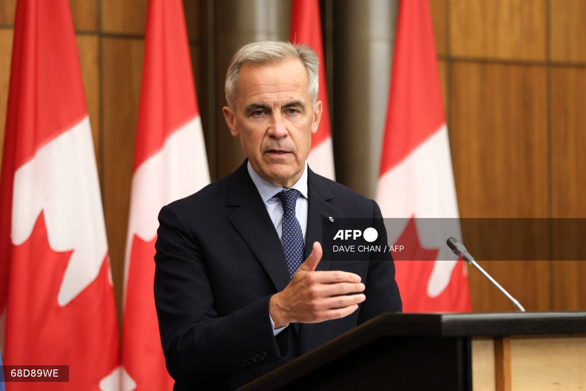 Canadian Prime Minister Mark Carney speaks during a press conference after a Cabinet meeting to discuss both trade negotiations with the US and the situation in the Middle East, at the National Press Theatre in Ottawa, Ontario, Canada on July 30, 2025. - AFP