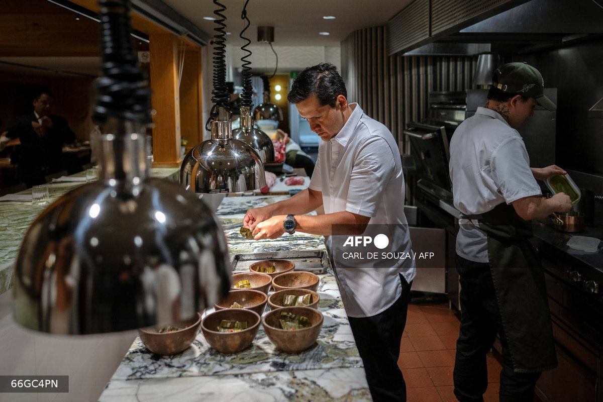 Head Chef Jorge Vallejo works in the kitchen at Quintonil restaurant in Mexico City on July 10, 2025. Behind the growing international success of a Mexican restaurant named one of world's best is a love story between two gourmets with a passion for blending traditional and contemporary flavors. Quintonil, which opened in 2012 in the upscale Mexico City neighborhood of Polanco, already boasted two Michelin stars. - AFP
