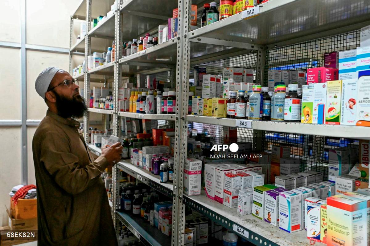 An employee checks the stock of medicines at a pharmacy store in Hyderabad on July 31, 2025. - AFP
