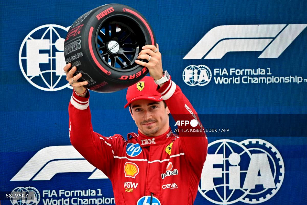 Ferrari’s Monegasque driver Charles Leclerc reacts after he won the pole position during the qualifying session of the Formula One Hungarian Grand Prix at the Hungaroring circuit in Mogyorod, near Budapest, Hungary, on August 2, 2025. (Photo by Attila KISBENEDEK / AFP)