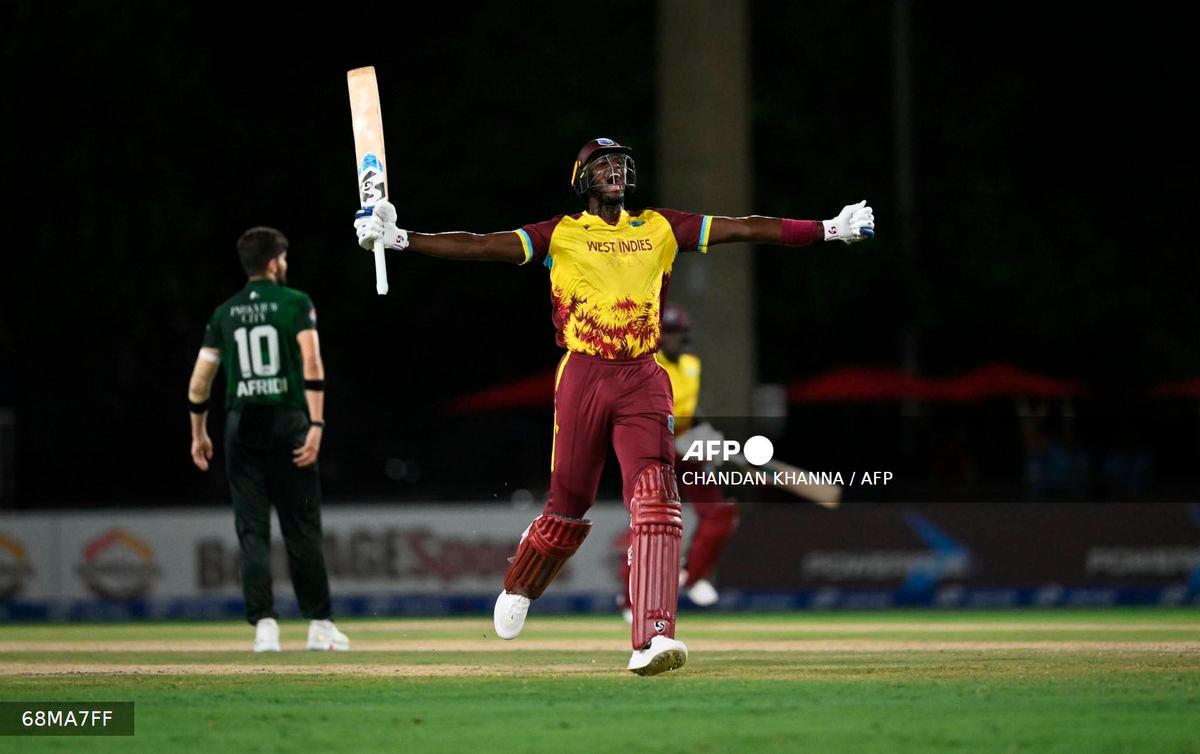 West Indies’ Jason Holder raises his arms in celebration after hitting the winning run during the second Twenty20 (T20) international cricket match between West Indies and Pakistan at Central Broward Park &amp; Broward County Stadium in Lauderhill, Florida, on August 2, 2025. (Photo by Chandan Khanna / AFP)