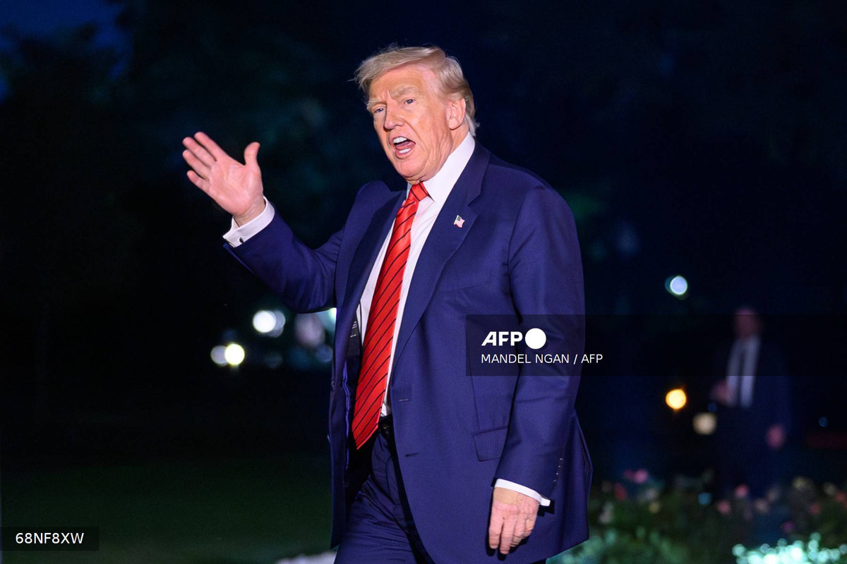 US President Donald Trump waves as he walks across the South Lawn upon return to the White House in Washington, DC on August 3, 2025 after spending the weekend at his Bedminster residence. - AFP