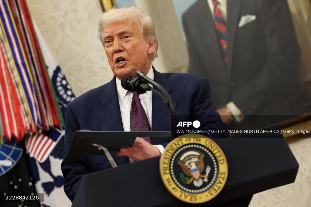 U.S. President Donald Trump speaks during an event with Apple CEO Tim Cook in the Oval Office of the White House on August 6, 2025 in Washington, DC. - AFP