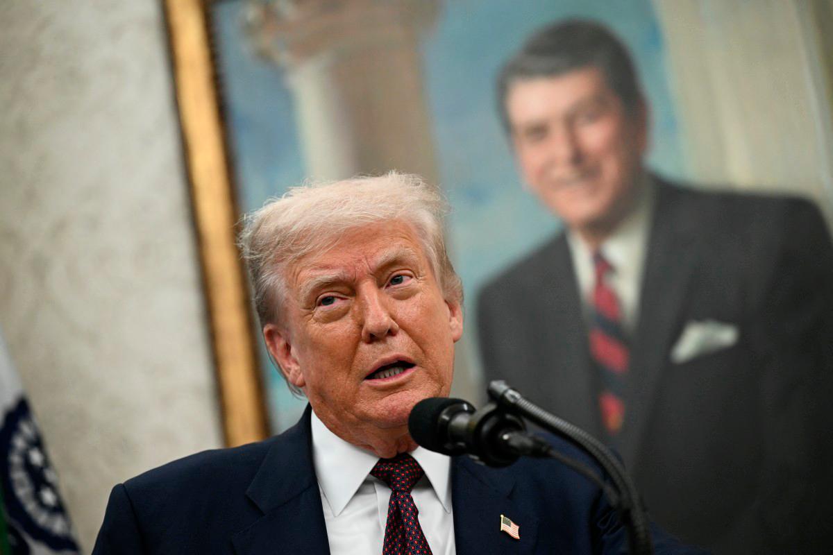 US President Donald Trump speaks in the Oval Office of the White House in Washington, DC. (Photo by Brendan SMIALOWSKI / AFP)