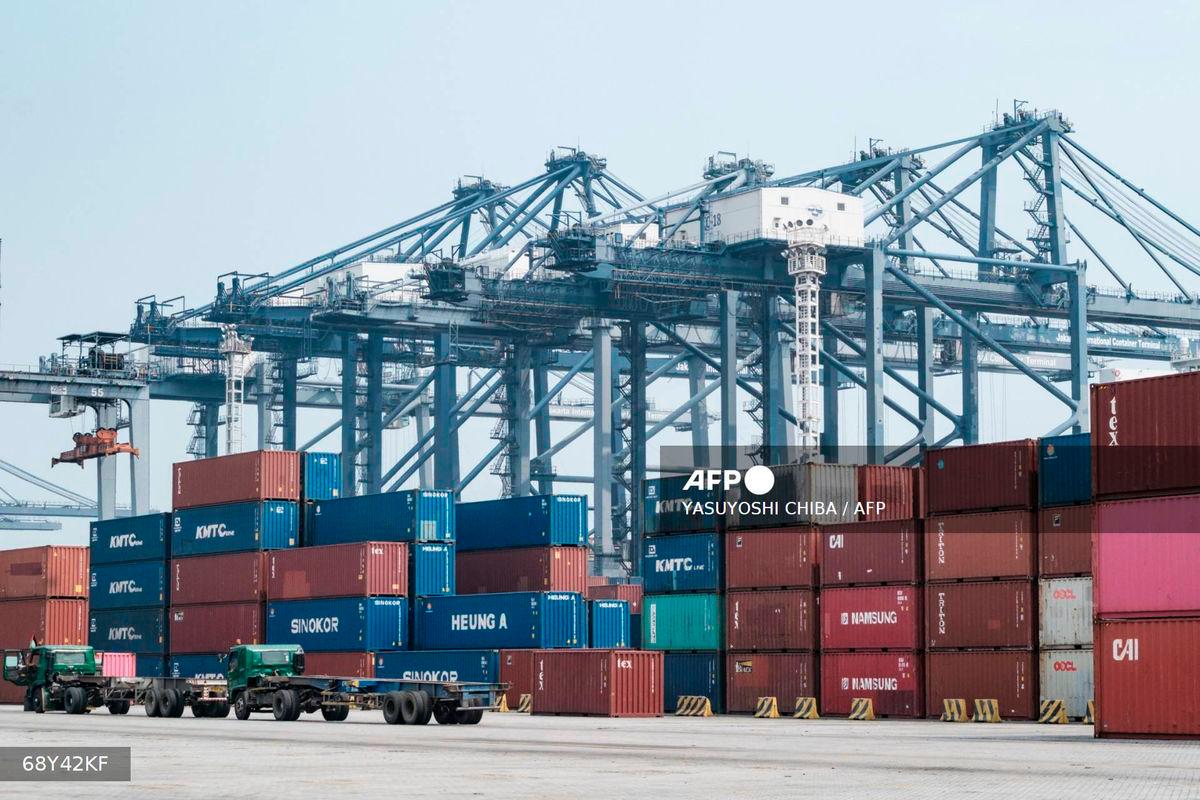 Cargo containers are stacked at the Jakarta International Container Terminal in Tanjung Priok Port, Jakarta, on August 7, 2025, as the United States begins enforcing a new 19 percent tariff on Indonesian imports. - AFP
