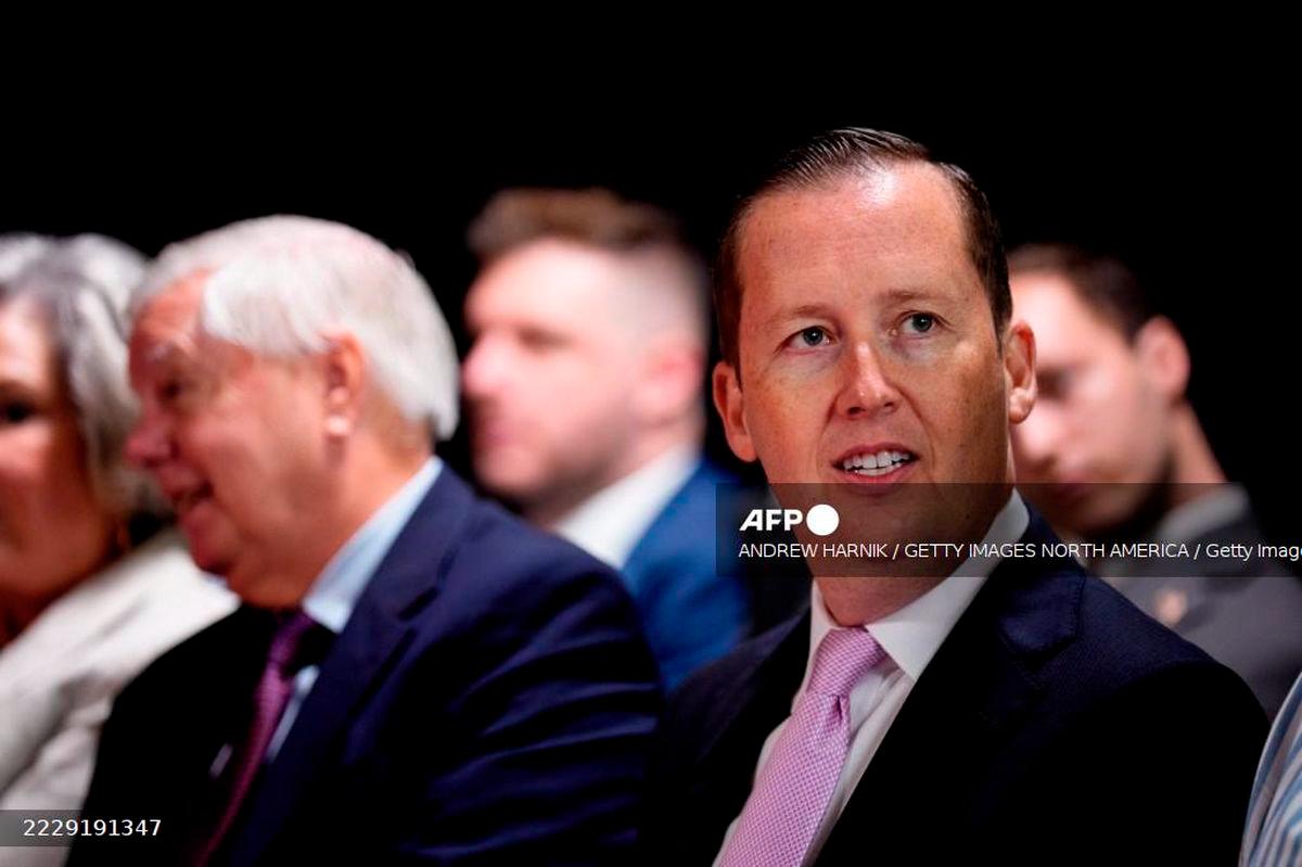 Assistant to the President Sergio Gor (R), accompanied by Sen. Lindsey Graham (R-SC) (L), waits before U.S. President Donald Trump arrives for an event at the Kennedy Center on August 13, 2025 in Washington, DC. - Getty Images via AFP