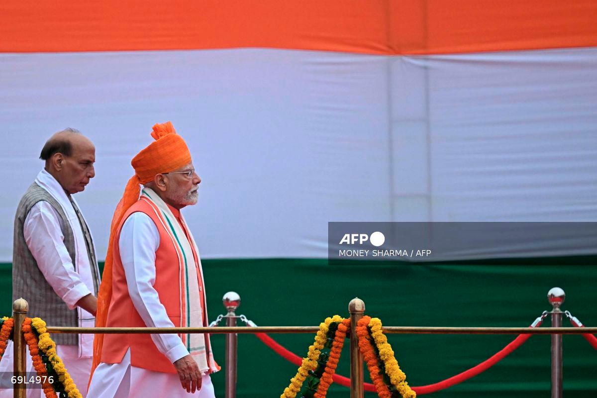 India’s Prime Minister Narendra Modi (R) walks along with Defence Minister Rajnath Singh upon his arrival to address the nation from the ramparts of the Red Fort during the celebrations to mark country’s Independence Day in New Delhi on August 15, 2025. - AFP
