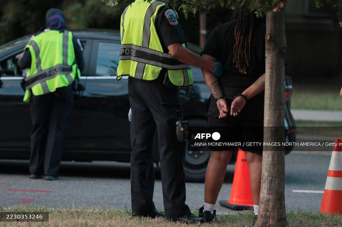 U.S. Federal Bureau of Investigation (FBI) and Metropolitan Police Department (MPD) detain a person as they conduct a traffic stop near the Navy Yard neighborhood on August 15, 2025 in Washington, DC. - Getty Images via AFP