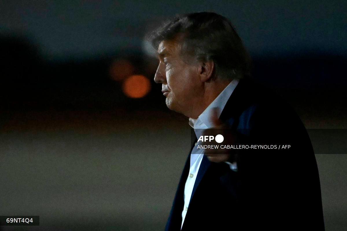 US President Donald Trump gives a thumbs up after landing at Joint Base Andrews in Maryland, on August 15, 2025. - AFP