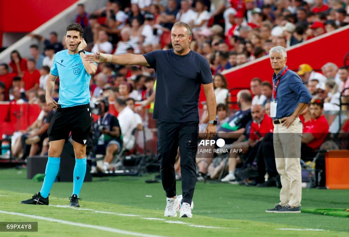 Barcelona's German coach Hansi Flick gestures during the Spanish league football match between RCD Mallorca and FC Barcelona at Mallorca Son Moix Stadium in Palma de Mallorca on August 16, 2025. - AFPPIX