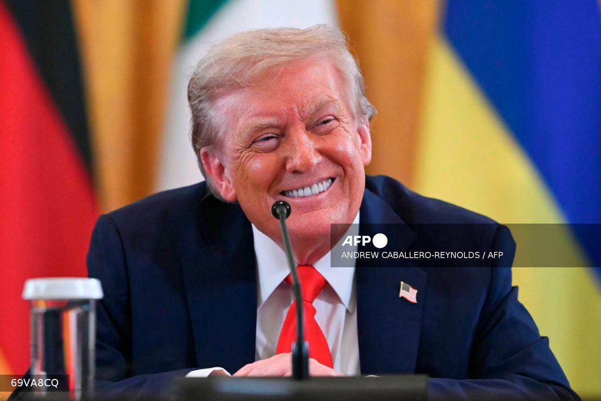 US President Donald Trump smiles during a meeting with Ukrainian President Volodymyr Zelensky and European leaders in the East Room of the White House in Washington, DC, on August 18, 2025. - AFP