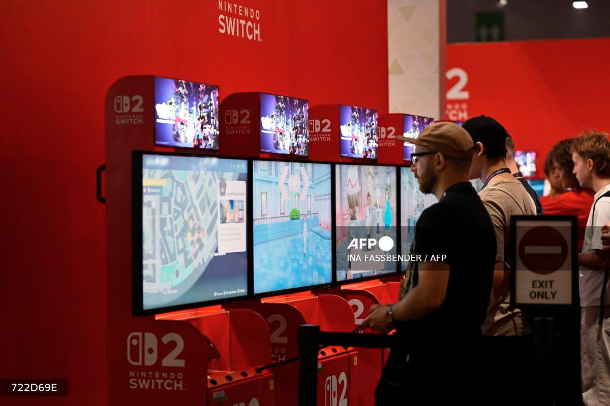 Gamers play the Pokemon-Legends: Z-A video game at the Ninentdo booth during the Gamescom video games trade fair at the Trade Fair Center in Cologne, western Germany, on the first day of the fair on August 20, 2025. - AFP