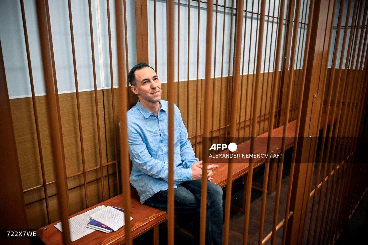 Laurent Vinatier, a French researcher accused of gathering Russian military information without registering as a foreign agent, sits inside a defendants' cage during a hearing in Moscow's Zamoskvoretsky district court on October 14, 2024. - AFP