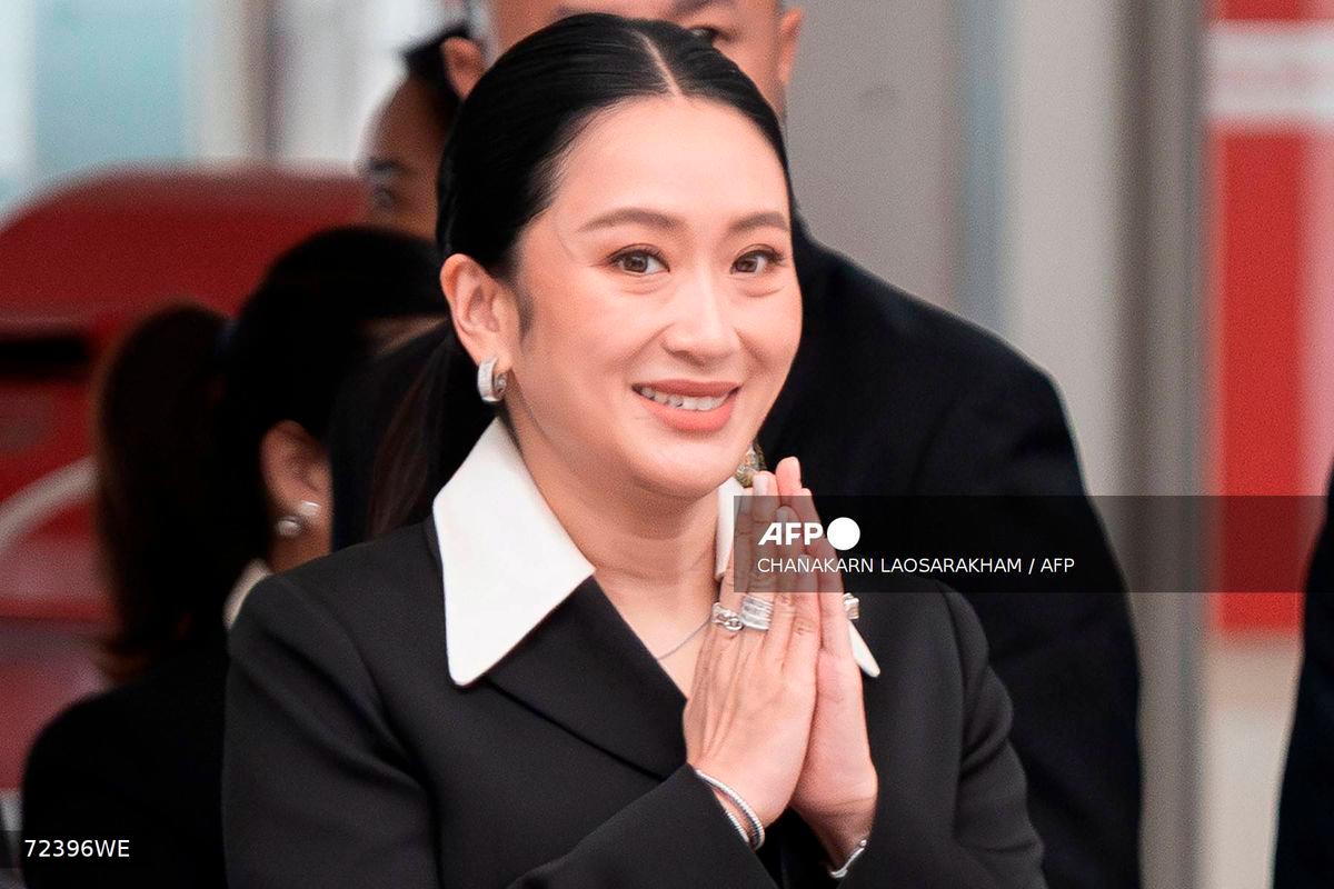 Thailand's suspended Prime Minister Paetongtarn Shinawatra gestures as she arrives at the Constitutional Court in Bangkok on August 21, 2025. - AFP