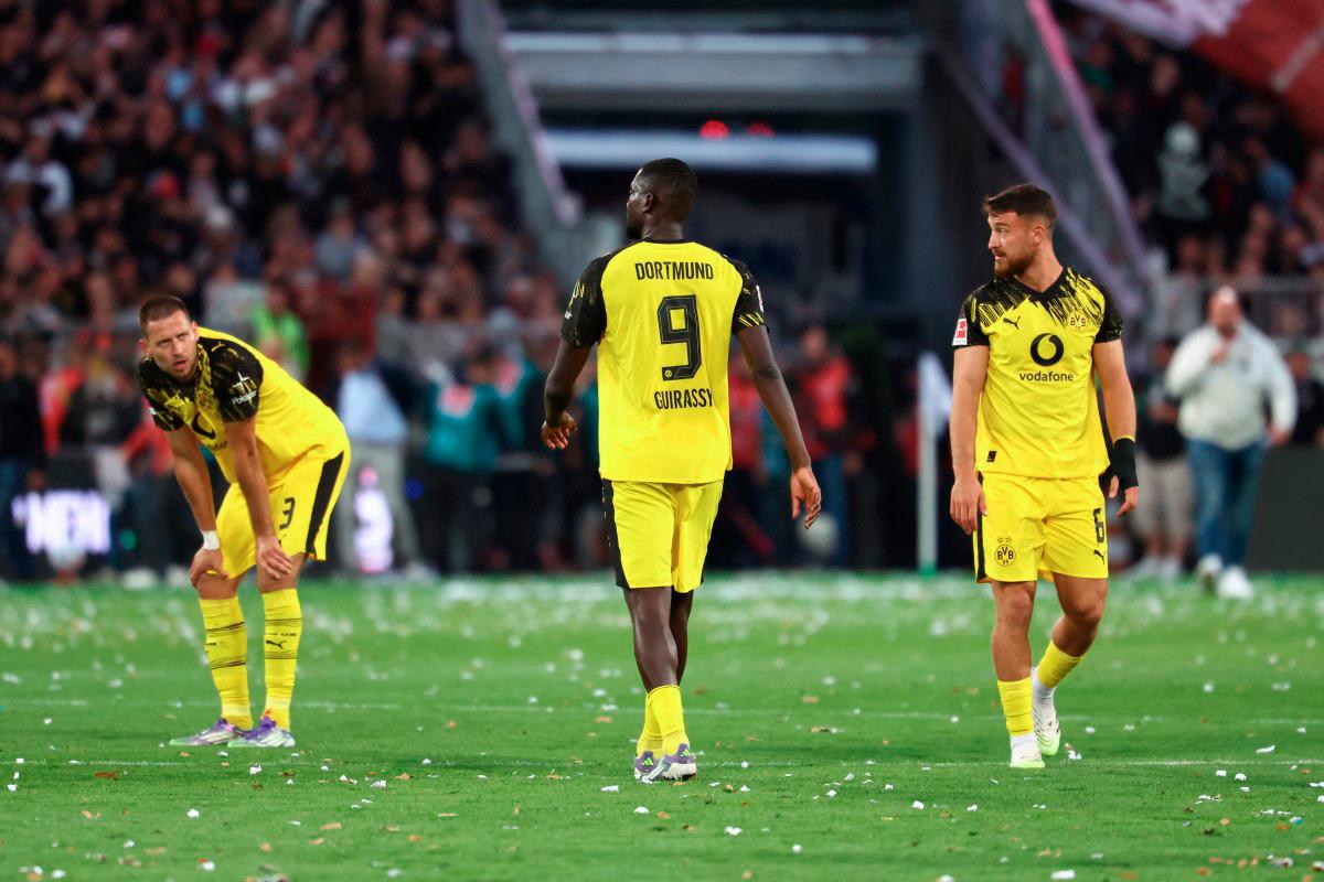 Dortmund’s defender Waldemar Anton, forward Serhou Guirassy and midfielder Salih Ozcan react after the German first division Bundesliga football match between FC St Pauli and Borussia Dortmund in Hamburg. The match ended in a 3-3 draw. - AFP