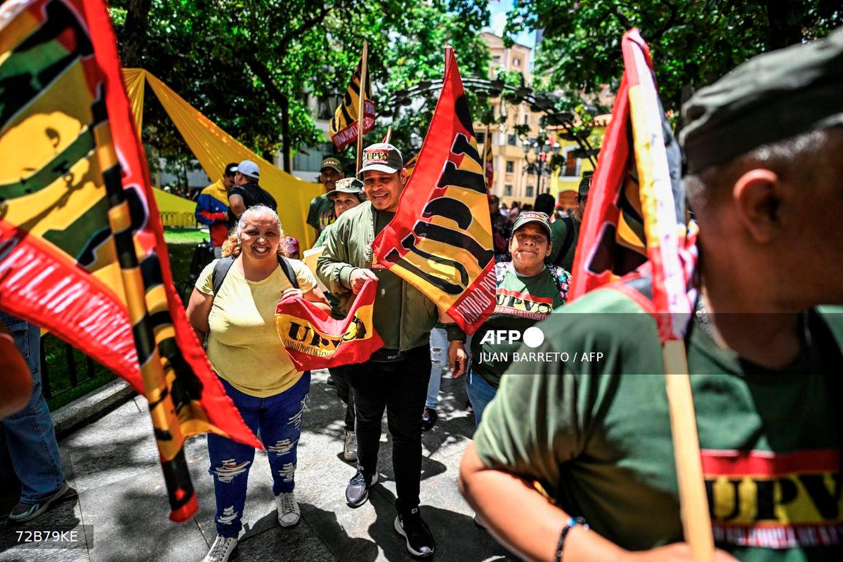 Members of Venezuelan Popular Unity (Unidad Popular Venezolana-UPV) take part in the national enlistment campaign called by the government of President Nicolas Maduro at Bolivar square in Caracas, on August 23, 2025. - AFP