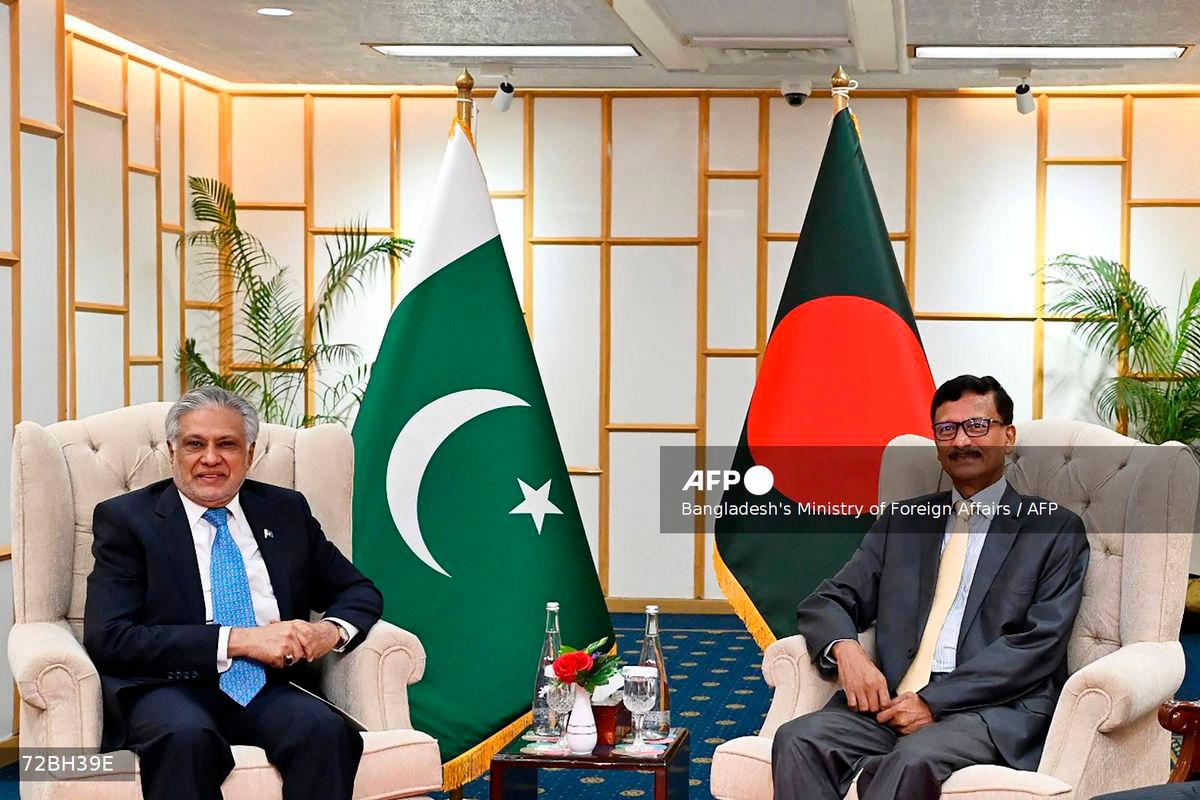 Foreign Affairs Advisor of Bangladesh’s interim government Mohammad Touhid Hossain (R) posing alongside Pakistan’s Foreign Minister Ishaq Dar during a bilateral meeting in Dhaka. - (Photo by Bangladesh’s Ministry of Foreign Affairs / AFP)