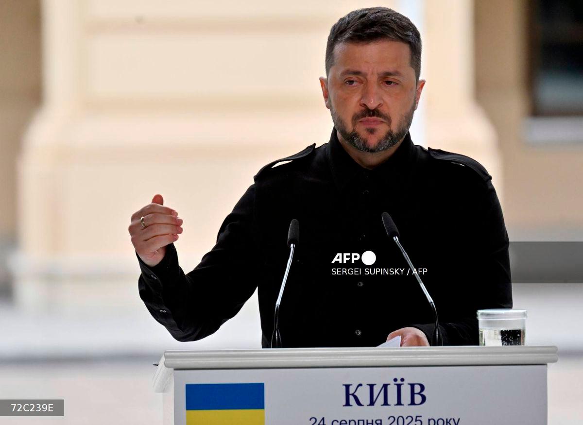 Ukrainian President Volodymyr Zelensky speaks during a press conference with Canadian Prime Minister following talks at Mariyinsky Palace in Kyiv on August 24, 2025, amid the Russian invasion in Ukraine. - AFP