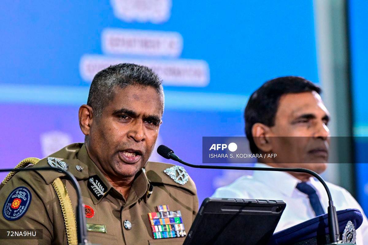 Sri Lanka’s Inspector General of Police Priyantha Weerasooriya (L) speaks as Minister of Public Security Ananda Wijepala looks on during a press conference in Colombo on August 28, 2025. Sri Lanka’s most wanted man has been arrested in Indonesia and will be extradited to face charges including gunning down a rival inside a court, officials said August 28. Public Security Ministry Secretary Ravi Seneviratne said Indonesian police had detained six Sri Lankans linked to several murders and organised drug-related crimes. (Photo by Ishara S. KODIKARA / AFP