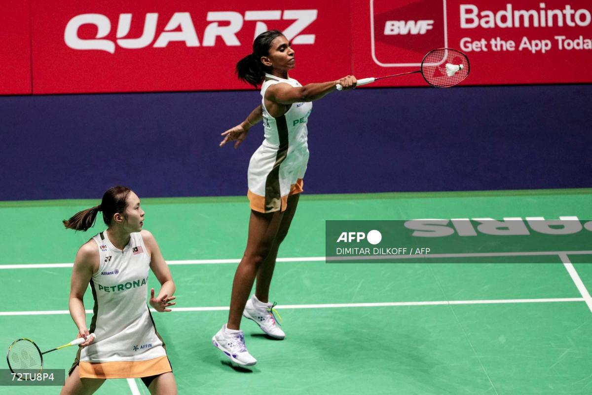 Malaysia's Pearly Tan (bottom) and Thinaah Muralitharan (top) compete against Bulgaria's Gabriela Stoeva and Stefani Stoeva during their women's double match at the Badminton BWF World Championships at the Adidas Arena in Paris, on August 29, 2025. - AFPPIX