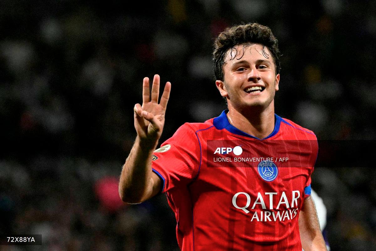 Paris Saint-Germain's Portuguese midfielder #87 Joao Neves celebrates scoring his team's sixth goal and his third goal during the French L1 football match between Toulouse FC and Paris Saint-Germain at The TFC Stadium in Toulouse, southwestern France on August 30, 2025. - AFP