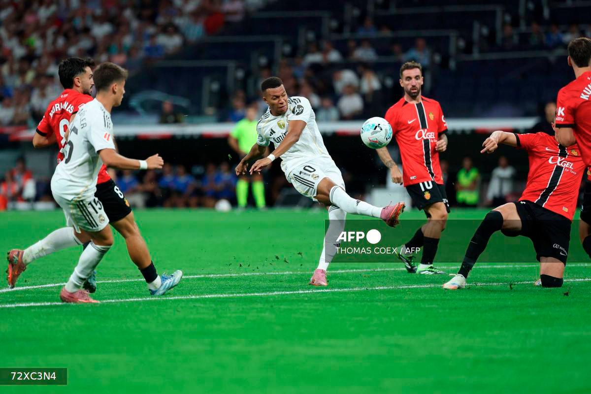 Real Madrid's French forward #10 Kylian Mbappe controls the ball during the Spanish league football match between Real Madrid CF and Real RCD Mallorca at the Santiago Bernabeu stadium in Madrid on August 30, 2025. - AFP